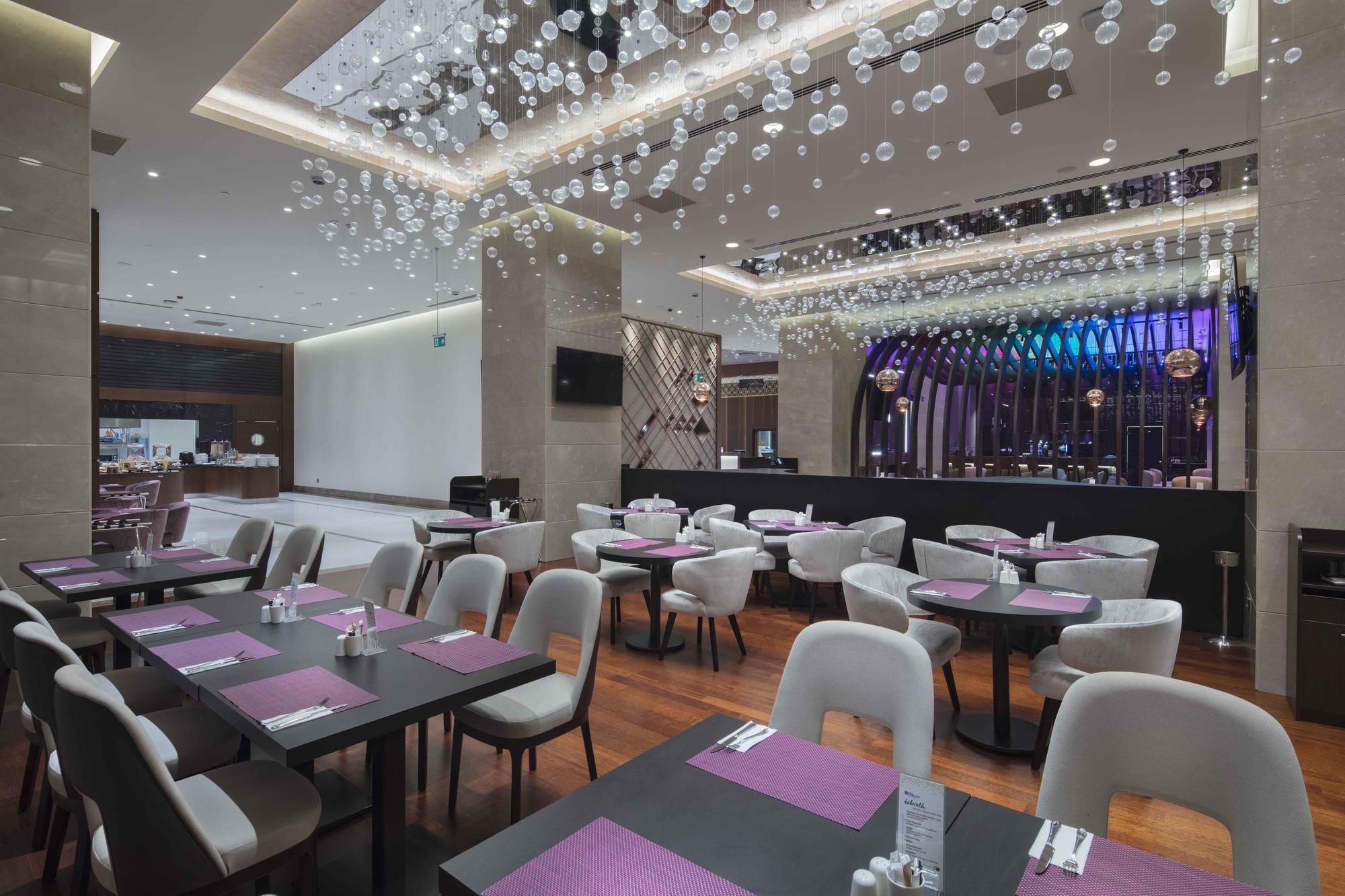 Hotel Doubletree By Hilton Istanbul Umraniye Esterno foto The interior of the restaurant